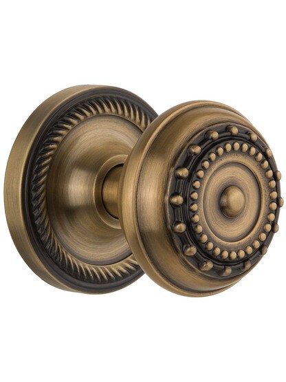 Rope Rosette Door Set With Meadows Door Knobs in Antique Brass.